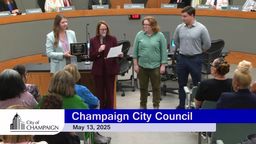 Mayor Feinen along with a representative handing out ACEC Award Bike Vision Implementation Plan to Associate Planners Lily Wilcock and Daniel Saphiere 