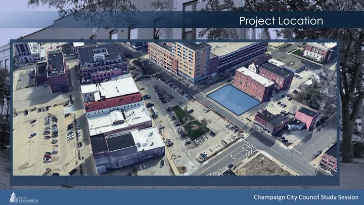 Presentation Slide with an arial view of downtown Champaign. 